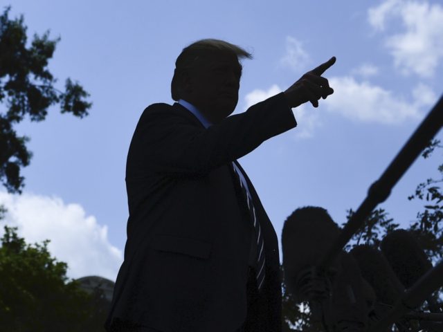 US President Donald Trump talks to the press before departing from the South Lawn of the White House on July 19, 2019, in Washington, DC. - Trump is heading to his golf resort in Bedminster, New Jersey to attend a fundraiser and spend the weekend. (Photo by Brendan Smialowski / …