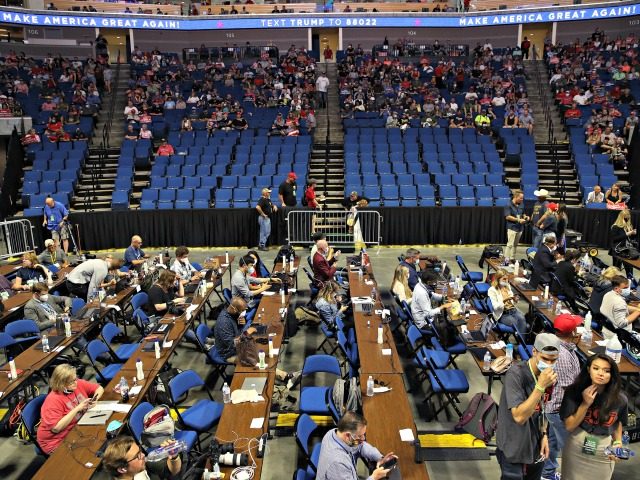 TULSA, OKLAHOMA - JUNE 20: Members of the media sit at tables during a campaign rally for U.S. President Donald Trump at the BOK Center, June 20, 2020 in Tulsa, Oklahoma. Trump is holding his first political rally since the start of the coronavirus pandemic at the BOK Center on …