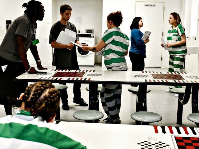 Inmates receive voter registration information from the Colorado Criminal Justice Reform C