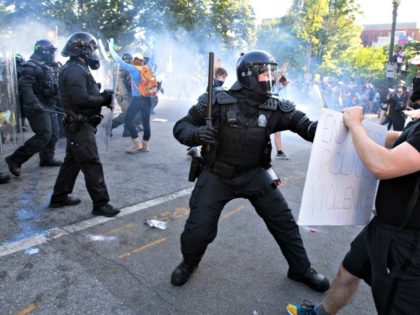 Police officers clash with protestors near the White House on June 1, 2020, as demonstrati