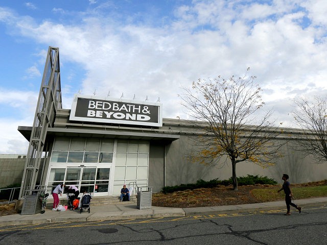 FILE - In this Oct. 25, 2017, file photo, shoppers stand outside of a Bed Bath & Beyond de