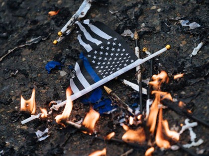 SACRAMENTO, CA - MARCH 02: Demonstrators burned Thin Blue Line flags outside Sacramento Police Department on March 2, 2019, in Sacramento, California. Sacramento County District Attorney Anne Marie Schubert announced Saturday that officers did not break any laws when they shot Stephon Clark in 2018. (Photo by Mason Trinca/Getty Images)