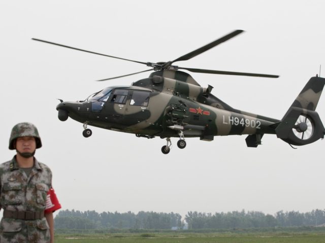 Chinese Army Z-9WZ attack helicopter, designed and manufactured by China, fly over during