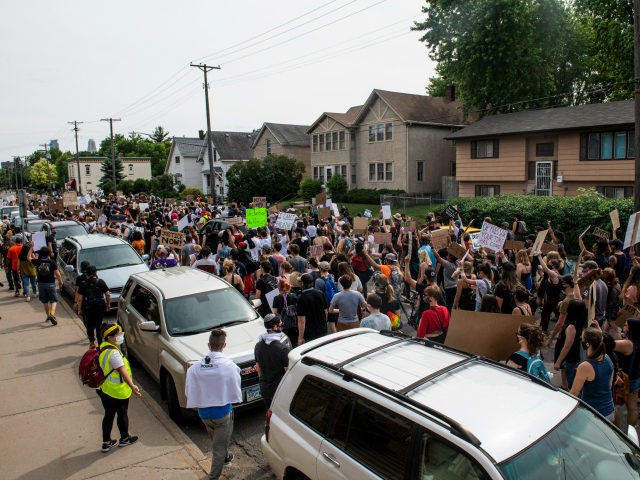 Demonstrators calling to defund the Minneapolis Police Department march on University Aven