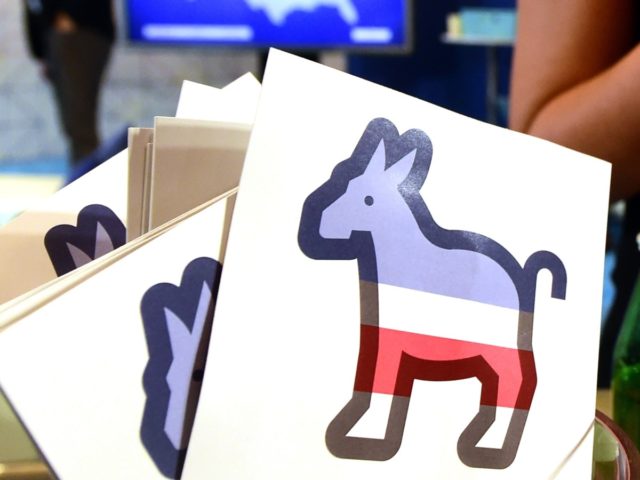 Paddles with the Donkey logo are seen at the Facebook section ahead of the Democratic presidential debate at the Wynn Hotel in Las Vegas, Nevada on October 13, 2015, hours before the first Democratic Presidential Debate. After ignoring her chief rival for months, White House heavyweight contender Hillary Clinton steps …