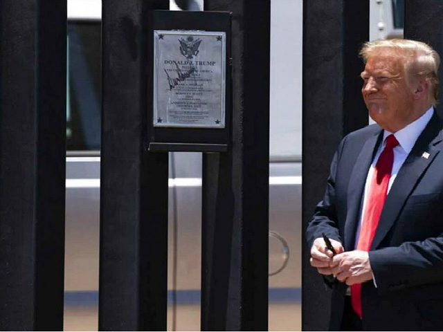 President Donald Trump smiles after autographing a section of the border wall during a tour, Tuesday, June 23, 2020, in San Luis, Ariz. (AP Photo/Evan Vucci)