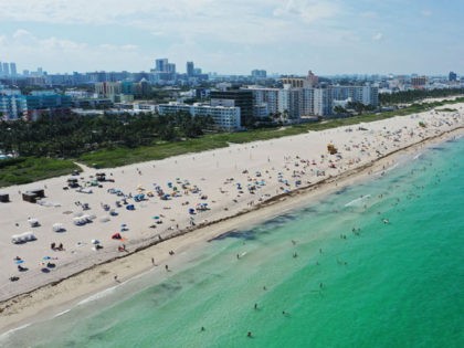 MIAMI BEACH, FLORIDA - JUNE 10: An aerial drone view as beachgoers take advantage of the opening of South Beach on June 10, 2020 in Miami Beach, Florida. Miami-Dade county and the City of Miami opened their beaches today as the area eases restrictions put in place to contain COVID-19. …