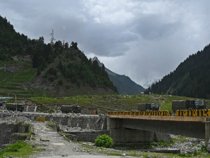 Indian army trucks drive along the Srinagar-Leh National Highway at Sonmarg some 89 Kms of