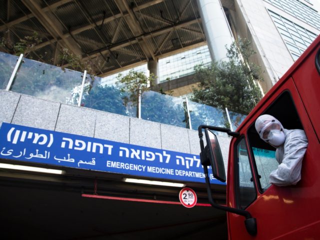 israel emergency treatment TEL AVIV, ISRAEL - MARCH 20: An Israeli Fire Department crew man drives a fire truck befor