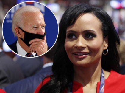 (INSET: Joe Biden) Republican Presidential Candidate Donald Trump spokeswoman Katrina Pierson talks with delegates on the convention floor during the final day of the Republican National Convention in Cleveland, Thursday, July 21, 2016. (AP Photo/Carolyn Kaster)
