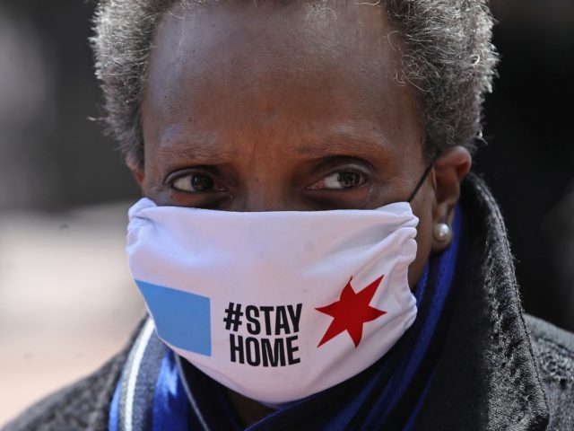 CHICAGO, ILLINOIS - APRIL 16: Chicago mayor Lori Lightfoot arrives at Wrigley Field on April 16, 2020 in Chicago Illinois. Wrigley Field has been converted to a temporary satellite food packing and distribution center in cooperation with the Lakeville Food Pantry to support ongoing relief efforts underway in the city …