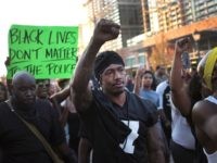 ST LOUIS, MO - SEPTEMBER 16: Radio and television personality Nick Cannon joins demonstrators protesting the acquittal of former St. Louis police officer Jason Stockley on September 16, 2017 in St. Louis, Missouri. Dozens of business windows were smashed and at least two police cars were damaged during a second …