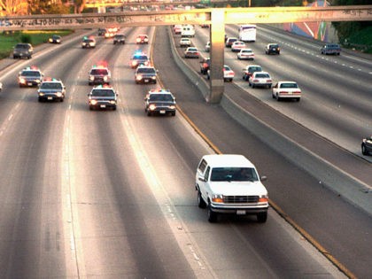 FILE - In this June 17, 1994, file photo, a white Ford Bronco, driven by Al Cowlings carrying O.J. Simpson, is trailed by Los Angeles police cars as it travels on a freeway in Los Angeles. Simpson’s ex-wife, Nicole Brown Simpson, and her friend Ron Goldman were found stabbed to …