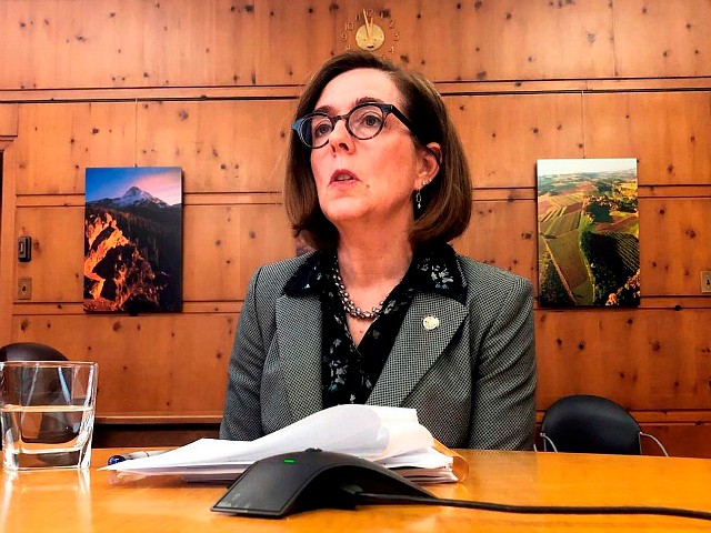 FILE - In this Monday, July 1, 2019, file photo, Oregon Gov. Kate Brown speaks with the media at the Capitol in Salem, Ore. Republican lawmakers were left fuming and justice reform advocates elated after Oregon's governor decided against calling a special session of the Legislature to have lawmakers review a new law narrowing death penalty cases. Gov. Kate Brown said late Wednesday, Sept. 18, 2019, that as much as she wanted a special session there would be none because stakeholders and legislators had failed to craft language to fix bill and line up enough votes to pass the redo. (AP Photo/Sarah Zimmerman, File)