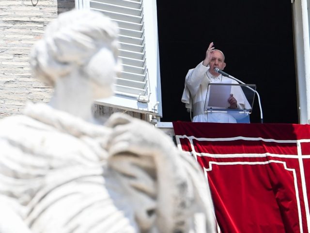 Pope Francis blesses the crowd from the window of the apostolic palace overlooking St Pete