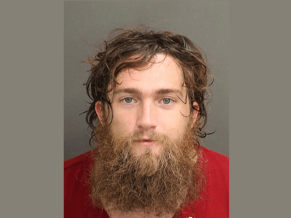 The man, whom police identified as Ramsey Moore, 29, has reportedly been charged by author
