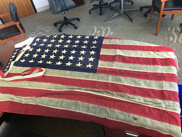 Anonymous Person Returns Historic American Flag Taken During Riots
