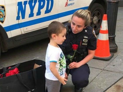 Father, Son Hand Out Roses to New York Police Officers