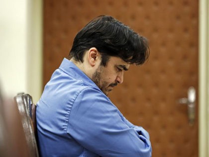 Ruhollah Zam, a former opposition figure who had lived in exile in France and had been implicated in anti-government protests, speaks during his trial at Iran's Revolutionary Court in Tehran on June 2, 2020. - Iran said it has sentenced to death Ruhollah Zam. The court has considered 13 counts …