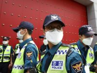 SEOUL, SOUTH KOREA - JUNE 04: South Korean policemen stand guard in front of Chinese embassy, during a rally to commemoration of Tiananmen square massacre and support Hong Kong pro-democracy protests near the Chinese embassy on June 04, 2020 in Seoul, South Korea. Participants commemorated the Tiananmen Square Massacre victims …