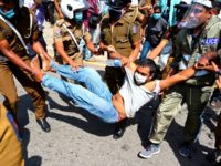 A Frontline Socialist Party (FSP) activist is taken into police custody during a protest against the brutal murder of George Floyd, an African-American man who died in Minneapolis after a policeman kneeled on his neck for several minutes, Colombo on June 9, 2020. - Sri Lanka June9 broke up a …