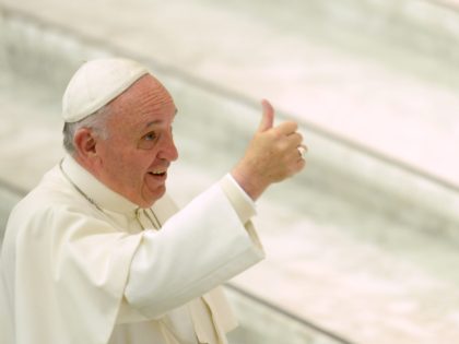 Pope Francis gives a thumbs-up as he greets people at the end of an audience to the participants of a meeting organized by the "Food Bank" on October 3, 2015 at the Paul VI audience hall in Vatican. AFP PHOTO / FILIPPO MONTEFORTE (Photo credit should read FILIPPO MONTEFORTE/AFP via …