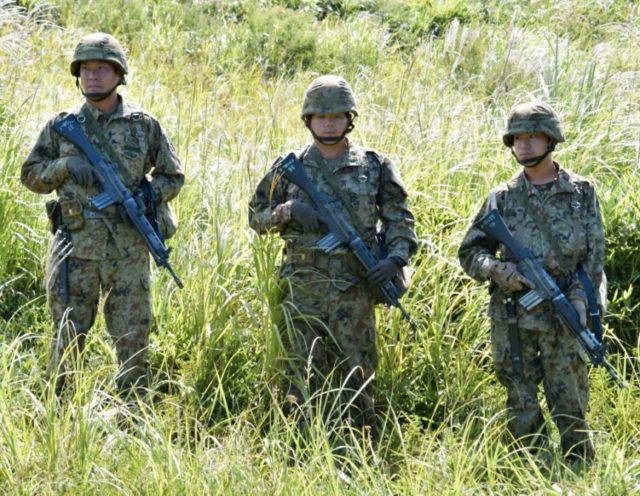 China warns Japan against new military plans