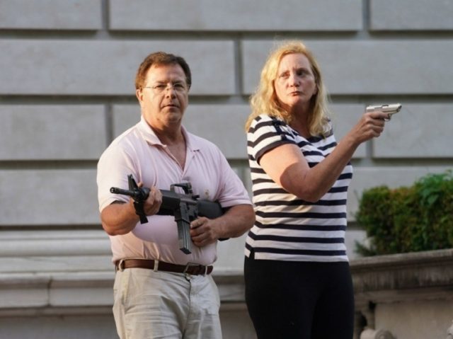 St. Louis couple point guns at protesters