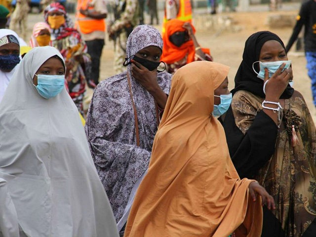 Female worshippers wear face masks as they arrives at Ramat Square Eid grounds in Maidugur