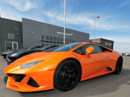 In this Sunday, March 15, 2020, photograph, an unsold 2020 Huracan Evo sports car sits at a Lamborghini dealership in Englewood, Littleton, Highlands Ranch, Colo. (AP Photo/David Zalubowski)