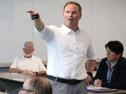 FILE - In this Aug. 26, 2019, file photo, U.S. Rep. Steve Watkins, R-Kan., makes a point during a town hall meeting, in Topeka, Kan. Watkins, a freshman Kansas congressman who had listed a UPS Inc. store as his residence on a voter registration, was criminally charged Tuesday, July 14, …