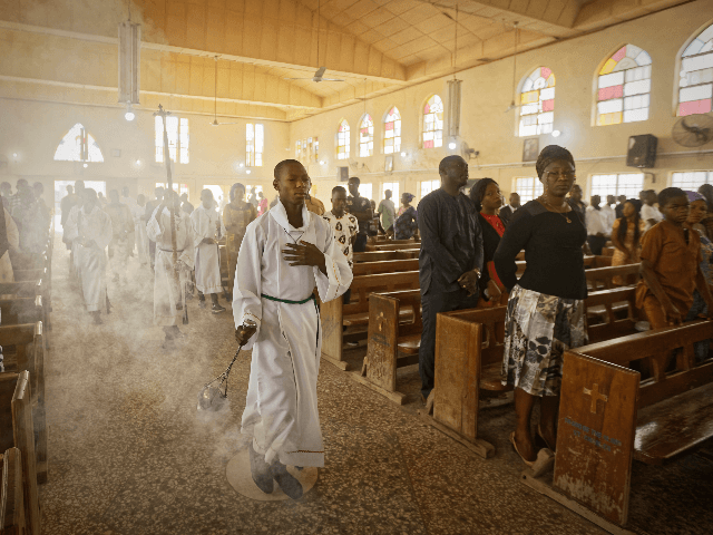 An altar boy swings the thurible of incense during a morning service at the Saint Charles Catholic Church, the site of a 2014 bomb attack blamed on Islamic extremist group Boko Haram, in the predominantly-Christian neighborhood of Sabon Gari in Kano, northern Nigeria Sunday, Feb. 17, 2019. With the leading …