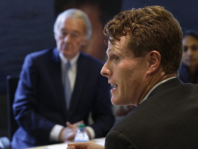 U.S. Sen. Edward Markey, D-Mass., left, and U.S. Rep. Joseph Kennedy III, D-Mass., right front, participate in a roundtable discussion, Tuesday, Oct. 1, 2019, in Boston, on the impact of a cap on refugee admissions to the U.S. for fiscal 2020. Massachusetts refugee resettlement agencies are urging the Trump administration …