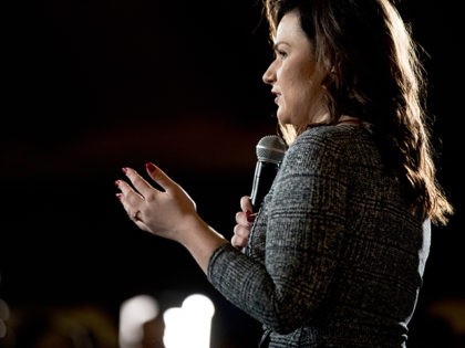 Rep. Abby Finkenauer, D-Iowa, speaks before welcoming Democratic presidential candidate former Vice President Joe Biden to the floor during a campaign stop at Simpson College, Saturday, Jan. 18, 2020, in Indianola, Iowa. (AP Photo/Andrew Harnik)