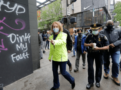 Seattle Mayor Jenny Durkan, left, surveys downtown Seattle with Police Chief Carmen Best on Sunday, May 31, 2020, following protests the night before over the death of George Floyd, a black man who was in police custody in Minneapolis. On Sunday morning, hundreds of people of all ages turned out …