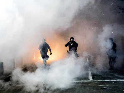 Federal officers use crowd control munitions to disperse Black Lives Matter protesters out