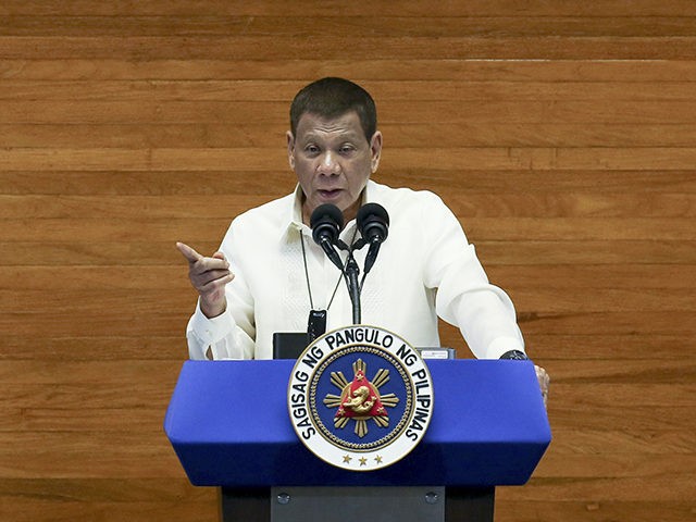 In this photo provided by the Malacanang Presidential Photographers Division, Philippine President Rodrigo Duterte delivers his State of the Nation Address (SONA) while Senate President Vicente Sotto III, left, and House Speaker Alan Peter Cayetano listen at the House of Representative in Metro Manila, Philippines, Monday, July 27, 2020. (Simeon …