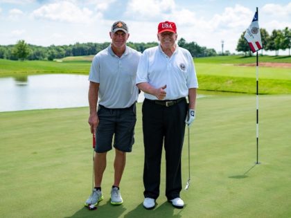 President Donald J. Trump poses for a photo with football legend Brett Favre at Trump Nati