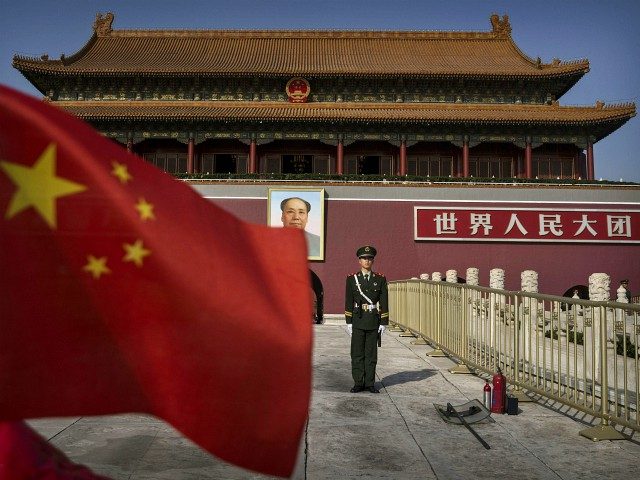 BEIJING, CHINA - OCTOBER 27: A Chinese soldier stands guard in front of Tiananmen Gate outside the Forbidden City on October 27, 2014 in Beijing, China. (Photo by Kevin Frayer/Getty Images)