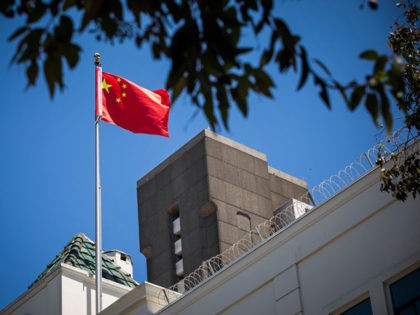 The flag of the People's Republic of China flies in the wind above the Consulate General of the People's Republic of China in San Francisco, California on July 23, 2020. - The US Justice Department announced July 23, 2020 the indictments of four Chinese researchers it said lied about their …