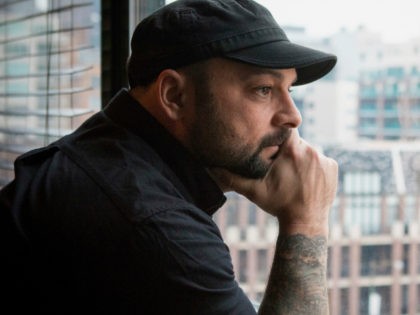 In this Jan. 9, 2017, photo, Christian Picciolini, founder of the group Life After Hate, poses for a photograph in his Chicago home. Picciolini, a former skinhead, is an activist combatting what many see as a surge in white nationalism across the United States. He's doing it by helping members …