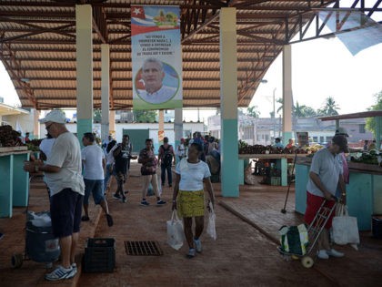 A poster of Cuban president Miguel Diaz-Canel is seen in a market in Havana, on September
