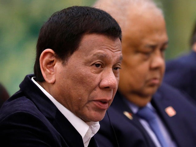 BEIJING, CHINA - AUGUST 30: Philippine President Rodrigo Duterte (L) speaks to Chinese Pre