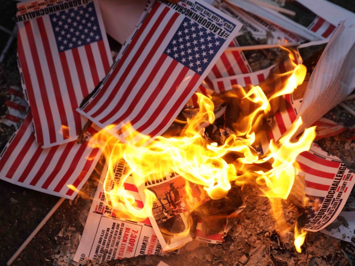 Flags burning Fourth of July (Alex Wong / Getty)