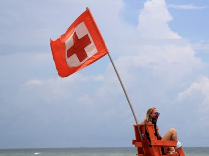 JACKSONVILLE BEACH - JULY 04: A lifeguard watches swimmers on July 04, 2020 in Jacksonvill