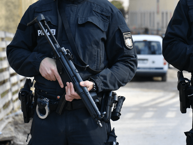 MUNICH, GERMANY - FEBRUARY 21: Police stand near the site where a man reportedly shot dead another man and then himself on February 21, 2019 in Munich, Germany. The circumstances behind the shooting that took place near the city's district office (Landratsamt) are so far unclear. (Photo by Lennart Preiss/Getty …
