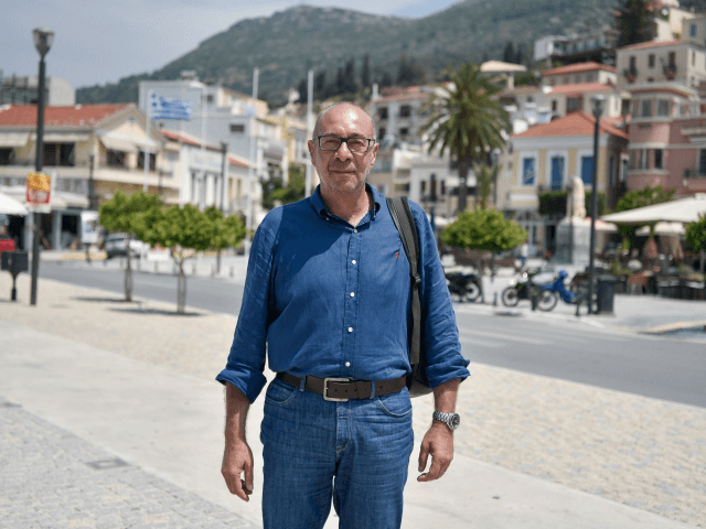 Georgios Stantzos, who was in June elected mayor for a constituency accounting for half of Samos, poses in the center of Vathy at Samos island on June 19, 2019. - "It's as if the EU decided to make Samos a warehouse of human souls," he told AFP. With nearly 9,000 …