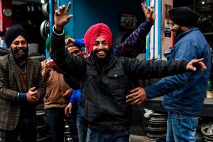 Sikh refugees from Pakistan and Afghanistan celebrate the approval of the government's Citizenship Amendment Bill (CAB) in Amritsar on December 12, 2019. - Indian police fired blanks on December 12 as thousands of protesters ignored a curfew in the north-east of the country, in a fresh day of demonstrations against contentious new …
