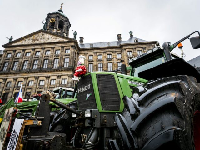 Tractors are parked on the Dam Square in Amsterdam on December 13, 2019 during a protest a