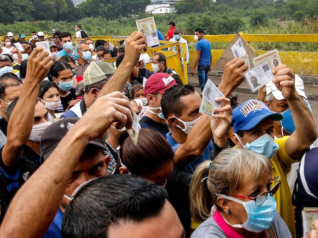 People coming from Venezuela with protective face masks as a precautionary measure to avoi
